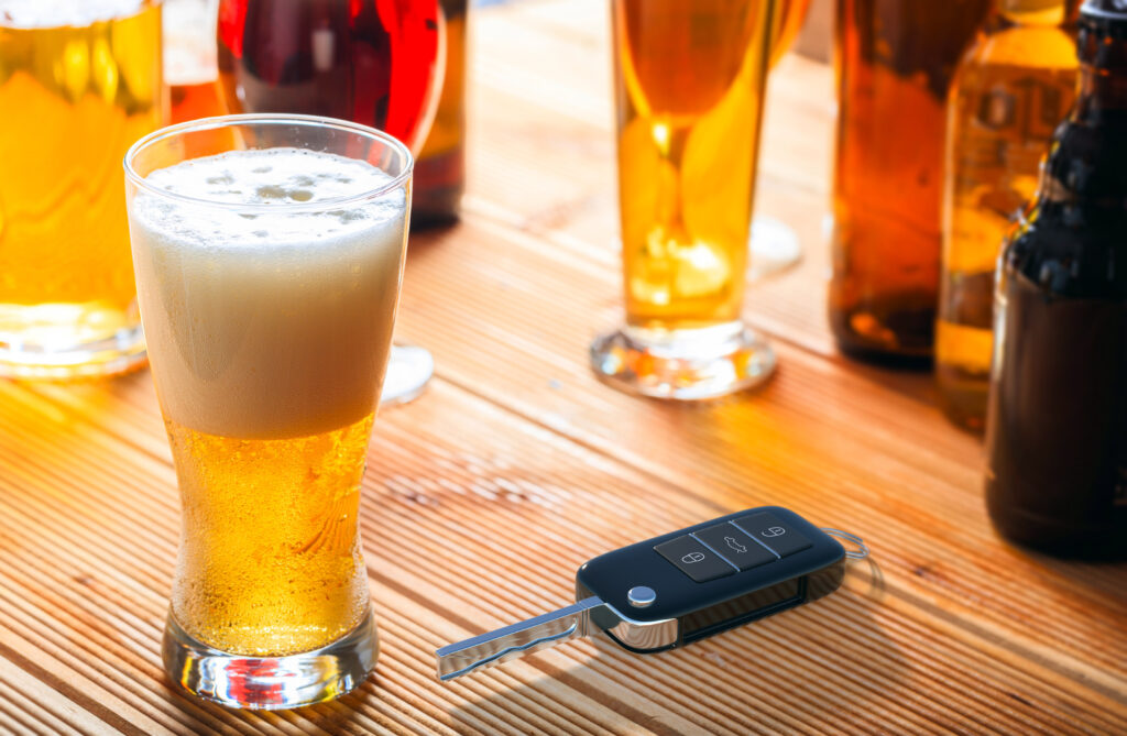 Car keys on pub table, next to beers